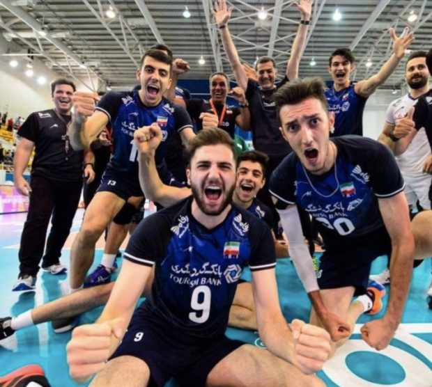 Iran's volleyball team players celebrating their world title 