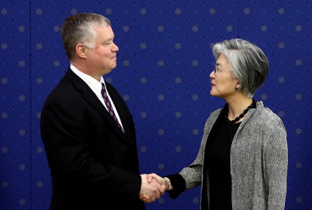 epa07559730 US Special Representative to North Korea Stephen Biegun (L) and South Korean Foreign Minister Kang Kyung-wha (R) pose for photos during their meeting at the Ministry of Foreign Affairs in Seoul, South Korea, 10 May 2019. Biegun is on a three-day visit to South Korea to discuss North Korean denuclearization. North Korea fired what were believed to be two short-range missiles on 09 Ma, just five days after the communist nation launched a barrage of projectiles into the East Sea.  EPA/CHUNG SUNG-JUN / POOL
