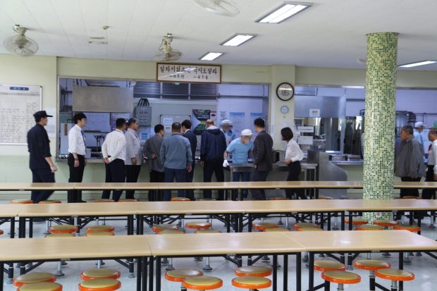 Lining up for Korean lunch prepared by the inmates