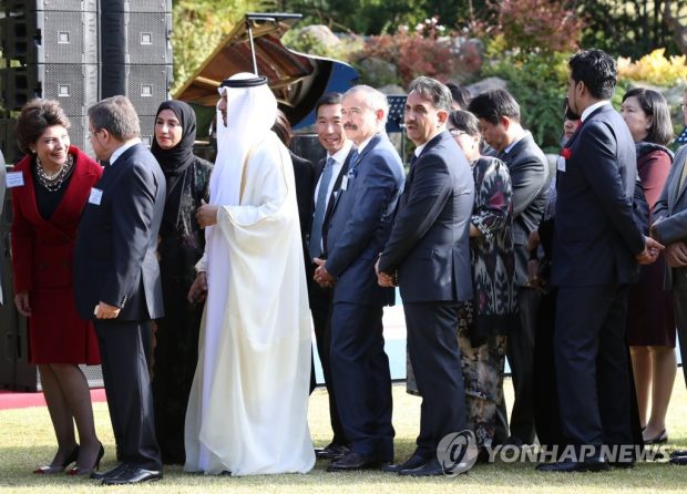 Foreign ambassadors wait in line to be greeted by President Moon Jae-in during a Cheong Wa Dae garden reception in Seoul on Oct. 18, 2019. (Yonhap)