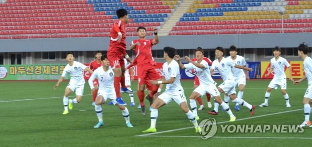 South Korea (in white) and North Korea (in red) in action in their Group H match in Pyongyang on Oct. 15, 2019. (Yonhap)