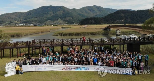 This photo, taken Oct. 17, 2019, shows participants in the ASEAN-Korea Train event posting for a photo in the Suncheon Bay Wetland Reserve in Suncheon, about 415 kilometers south of Seoul. (Yonhap)