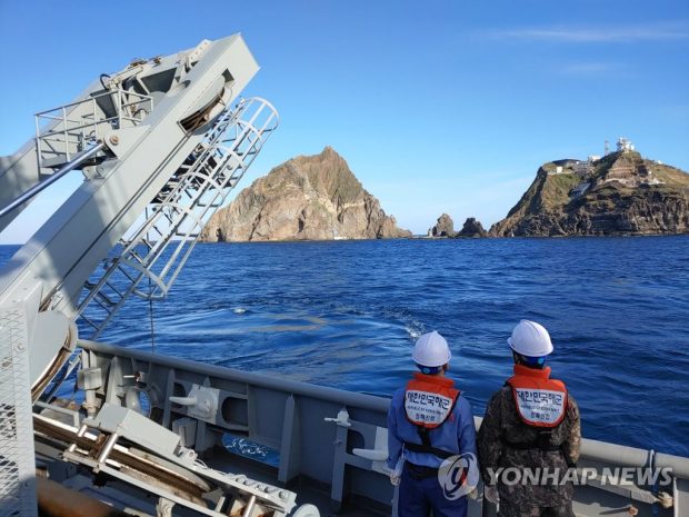 The Navy's Cheonghaejin submarine rescue ship is on an underwater mission on Nov. 2, 2019, to find those who went missing after a chopper crashed near the Dokdo islets, in this photo provided by the Korea Coast Guard. (Yonhap)