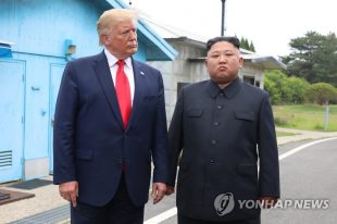 In this file photo, taken June 30, 2019, U.S. President Donald Trump (L) stands with North Korean leader Kim Jong-un before they hold talks at the Freedom House on the southern side of the truce village of Panmunjom in the Demilitarized Zone, which separates the two Koreas. (Yonhap)