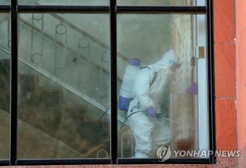 Disinfection work is carried out at a nursing hospital in this undated Yonhap file photo. (Yonhap)