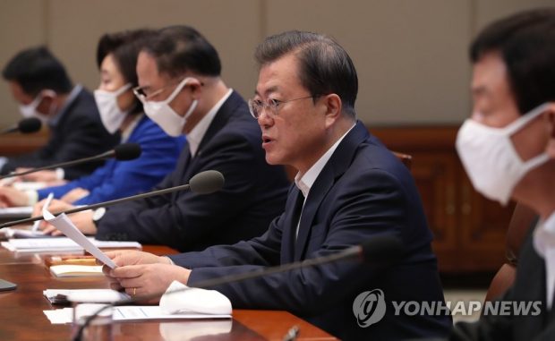 President Moon Jae-in (2nd from R) speaks during a third emergency economic council meeting at Cheong Wa Dae in Seoul on March 30, 2020. (Yonhap)