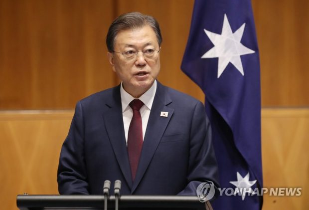  President Moon Jae-in speaks at a joint press conference with Australian Prime Minister Scott Morrison at the Parliament House in Canberra on Dec. 13, 2021. (Yonhap)