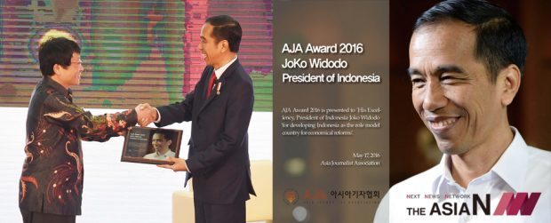 President Joko is presented the award by Sang-ki Lee at a ceremony 