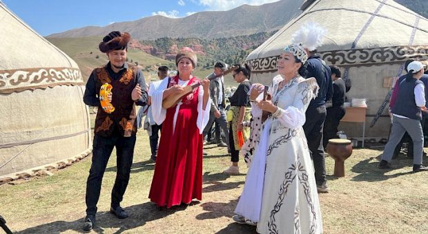 Kyrgyz men and women from several regions gather at an ethno-city to celebrate the nation's Independence Day