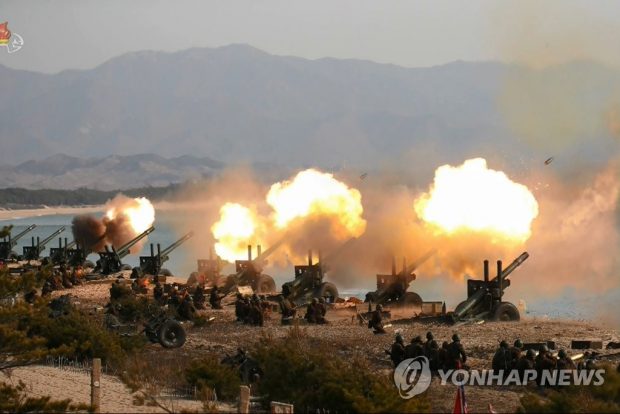 his photo, released in March 2020 by North Korea's official Korean Central Television, shows the country's artillery units firing shells. (For Use Only in the Republic of Korea. No Redistribution) (Yonhap)