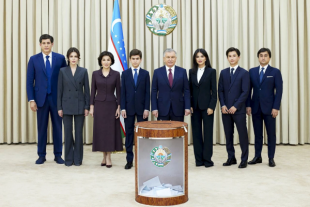 President Shavkat Mirziyoyev with his family following the vote