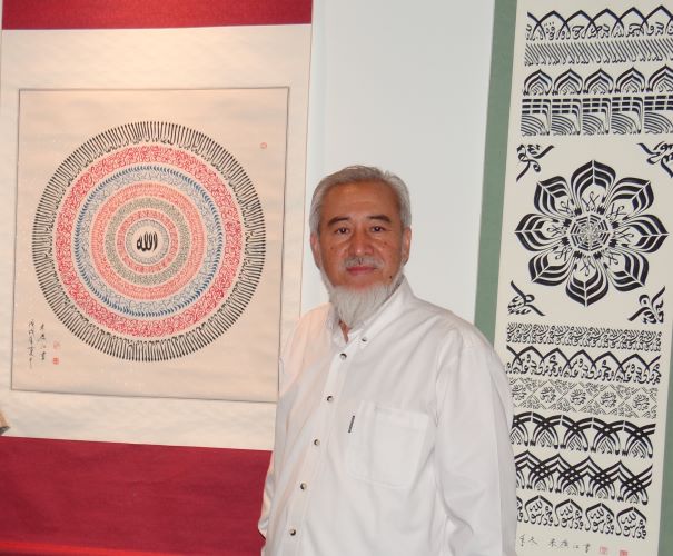 Haji Noor Deen with some of his artworks at Al Bader Festival in Fujairah, UAE