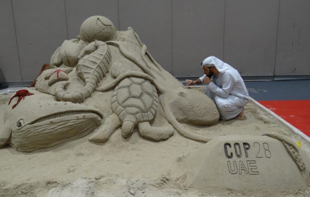 Shadi applying touches to his UAE marine life sculpture