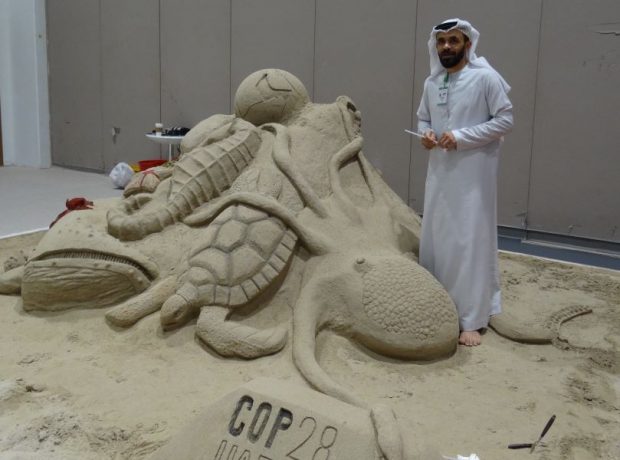 Shadi beside his UAE marine life sculpture