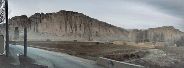 Bamiyan Stone Buddhas captured in panorama. Even though it was filmed in panoramic mode, it was not possible to capture the entire appearance of the Large Stone Buddha and the Small Stone Buddha. On the paved road in front of the stone Buddha, large trucks came and went, blowing up dust as if construction work was going on somewhere.