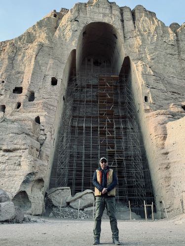 The author in front of the Great Stone Buddha, which is currently under restoration construction.