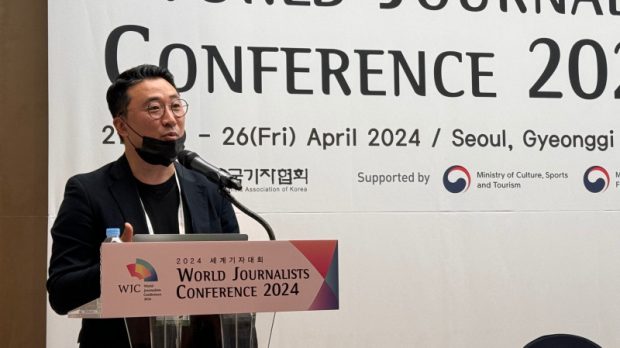 Ray Minseong Kim addressing the conference (WJC2024)